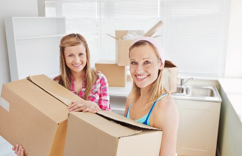 Packed boxes and wrapped household items ready for flat removal